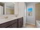 Bathroom features dual sinks and dark wood cabinetry at 4585 Woodland Bank Blvd, Buford, GA 30518
