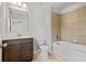 Well lit bathroom featuring a vanity with modern fixtures and a shower-tub combo at 4585 Woodland Bank Blvd, Buford, GA 30518