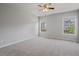 Spacious bedroom with carpet flooring and two windows providing natural light at 4585 Woodland Bank Blvd, Buford, GA 30518