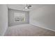 Spacious bedroom with carpet flooring and one window providing natural light at 4585 Woodland Bank Blvd, Buford, GA 30518
