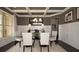 Formal dining room features wainscoting, dark wood floors, and a glass table at 4585 Woodland Bank Blvd, Buford, GA 30518