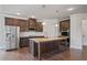 Modern kitchen with stainless steel appliances and center island at 4585 Woodland Bank Blvd, Buford, GA 30518