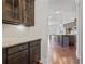 Convenient butlers pantry with granite countertops and access to main kitchen at 4585 Woodland Bank Blvd, Buford, GA 30518