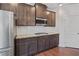 Modern kitchen with stainless steel appliances, granite countertops, and subway tile backsplash at 4585 Woodland Bank Blvd, Buford, GA 30518