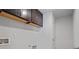 A laundry room with dark cabinets above the washer and dryer hookups at 4585 Woodland Bank Blvd, Buford, GA 30518