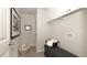 Laundry room featuring ample storage and a comfortable bench at 4585 Woodland Bank Blvd, Buford, GA 30518