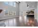 Open floor plan with soaring ceilings connects the living room to the kitchen at 4585 Woodland Bank Blvd, Buford, GA 30518