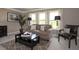 Cozy living room featuring neutral colors, plush seating, and natural light at 4585 Woodland Bank Blvd, Buford, GA 30518