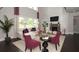 Bright living room featuring a fireplace, plush seating, and large windows at 4585 Woodland Bank Blvd, Buford, GA 30518