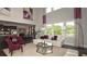 Open concept living area with fireplace, modern decor, and lots of natural light at 4585 Woodland Bank Blvd, Buford, GA 30518