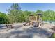 Well-maintained community playground with modern equipment, seating and a glimpse of the neighborhood pool at 4585 Woodland Bank Blvd, Buford, GA 30518