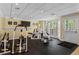 Home gym with exercise equipment and a bright window, perfect for fitness enthusiasts at 9860 Hunt Club Way, Johns Creek, GA 30022