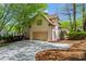 Beautiful two-story home with a two-car garage and a private deck, set on a spacious lot at 9860 Hunt Club Way, Johns Creek, GA 30022