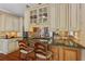 Charming kitchen with marble countertops, stainless steel appliances, and an island with bar seating at 9860 Hunt Club Way, Johns Creek, GA 30022