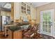 Kitchen with marble countertops, stainless steel appliances, and an island with bar seating at 9860 Hunt Club Way, Johns Creek, GA 30022