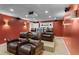 Home theater featuring plush leather seating and state-of-the-art projection equipment at 9860 Hunt Club Way, Johns Creek, GA 30022