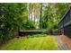 Landscaped backyard with tiered garden beds and lush greenery at 1477 Brawley Ne Cir, Brookhaven, GA 30319