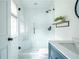 Modern bathroom with glass enclosed shower, white subway tile, and custom vanity at 1477 Brawley Ne Cir, Brookhaven, GA 30319