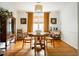 Bright dining room with hardwood floors, a traditional table, and elegant curtains at 1477 Brawley Ne Cir, Brookhaven, GA 30319