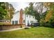 Back exterior view with deck, patio, and fire pit at 1477 Brawley Ne Cir, Brookhaven, GA 30319