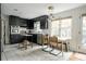 Well-lit kitchen featuring modern appliances, sleek cabinetry, and an adjacent dining area at 1477 Brawley Ne Cir, Brookhaven, GA 30319