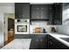 Well-appointed kitchen with sleek black cabinets, stainless steel oven, and elegant countertops at 1477 Brawley Ne Cir, Brookhaven, GA 30319