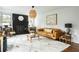 Comfortable living room with a brick fireplace, modern décor, and lots of natural light at 1477 Brawley Ne Cir, Brookhaven, GA 30319