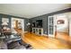 Open living space showcasing hardwood floors, a TV, and an open layout at 1477 Brawley Ne Cir, Brookhaven, GA 30319