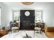 Cozy living room showcasing a brick fireplace and modern accents, perfect for relaxation at 1477 Brawley Ne Cir, Brookhaven, GA 30319