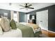 Comfortable main bedroom featuring hardwood floors, ceiling fan, and neutral color palette at 1477 Brawley Ne Cir, Brookhaven, GA 30319