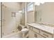 Modern bathroom with a tiled shower, glass door, and granite vanity at 201 Saddle Rd, Alpharetta, GA 30009