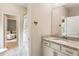 Bathroom featuring a granite vanity and access to a bedroom at 201 Saddle Rd, Alpharetta, GA 30009
