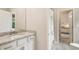 Bright bathroom with granite counters and neutral color palette at 201 Saddle Rd, Alpharetta, GA 30009