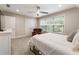 Inviting bedroom with a large window, neutral tones, and comfortable chair at 201 Saddle Rd, Alpharetta, GA 30009