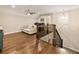 Spacious bonus room with hardwood floors, a ceiling fan, and a seating area at 201 Saddle Rd, Alpharetta, GA 30009