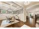 A dining room that features wallpaper, wainscoting, and an exquisite light fixture at 201 Saddle Rd, Alpharetta, GA 30009