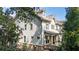 Exterior view of a home with traditional architecture and well-manicured landscaping at 201 Saddle Rd, Alpharetta, GA 30009