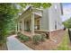 Charming exterior features a welcoming porch and well-maintained landscaping at 201 Saddle Rd, Alpharetta, GA 30009
