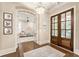 Elegant foyer with hardwood floors, stylish lighting, and charming decor at 201 Saddle Rd, Alpharetta, GA 30009