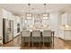 Bright kitchen with a large island, stainless steel appliances, and custom cabinets at 201 Saddle Rd, Alpharetta, GA 30009