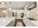 Modern kitchen with stainless steel appliances, island with breakfast bar, and stylish pendant lighting at 201 Saddle Rd, Alpharetta, GA 30009