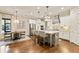 Eat-in kitchen with a large island, seating, stainless steel appliances, and modern lighting at 201 Saddle Rd, Alpharetta, GA 30009