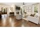 Spacious living room featuring a stone fireplace and large windows at 201 Saddle Rd, Alpharetta, GA 30009