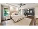 Beautiful main bedroom featuring hardwood floors, tray ceiling and a connected office space filled with natural light at 201 Saddle Rd, Alpharetta, GA 30009