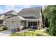 Two-story home featuring a screened-in porch and a two car garage at 201 Saddle Rd, Alpharetta, GA 30009