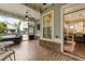 View from screened-in porch looking out to the yard and into the modern kitchen at 201 Saddle Rd, Alpharetta, GA 30009