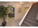 Finished basement area with tile flooring, stairs, and open doorway to a bedroom at 2815 Cambridge Hills Rd, Cumming, GA 30041