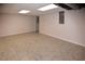 Finished basement area with tile floors and open ceiling at 2815 Cambridge Hills Rd, Cumming, GA 30041