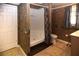 Full bathroom with shower, toilet, and textured wallpaper at 2815 Cambridge Hills Rd, Cumming, GA 30041