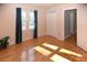Bright bedroom with hardwood floors, natural light, and closet for ample storage at 2815 Cambridge Hills Rd, Cumming, GA 30041
